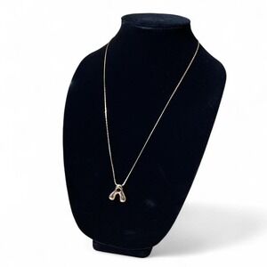 Gold tone Bubble A Pendant on a Monet necklace